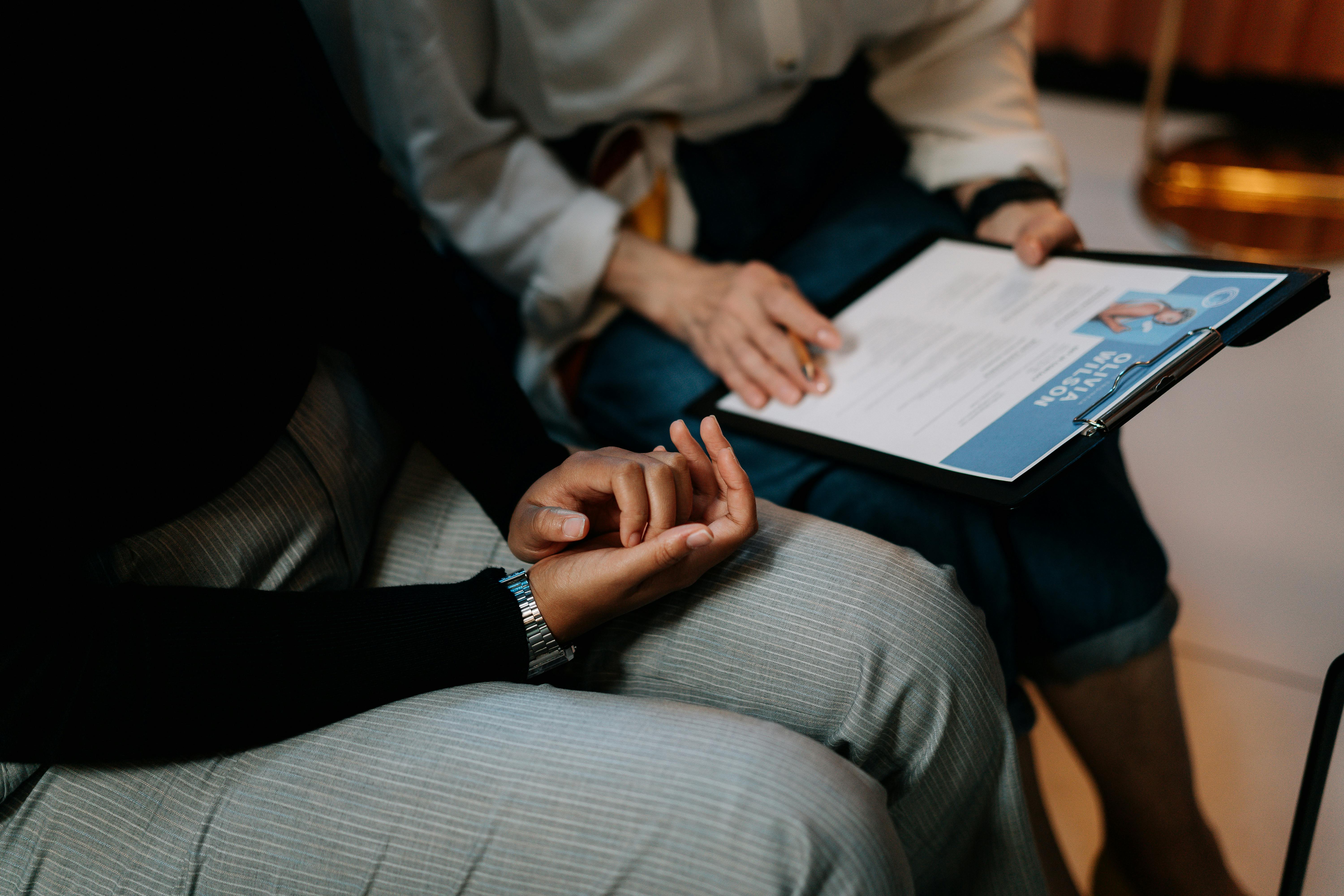 two people holding a cv